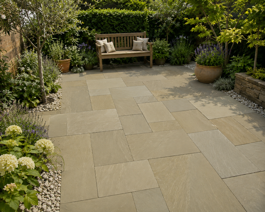 Paved patio area using raj green with a wooden bench surrounded by plants and flowers