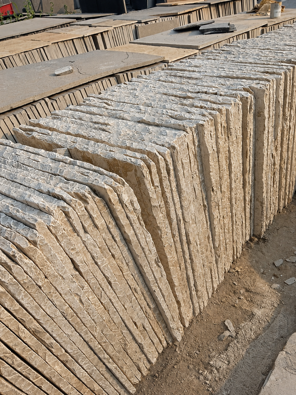Row of stone slabs stacked on a construction site